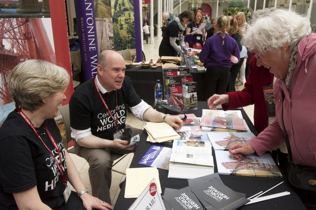 People standing around a stall at the World Heritage Day event