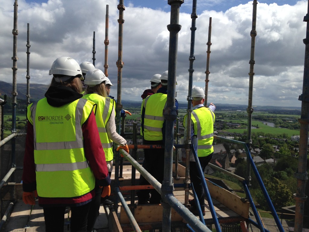Summer School attendees admiring the view from on top the scaffolding