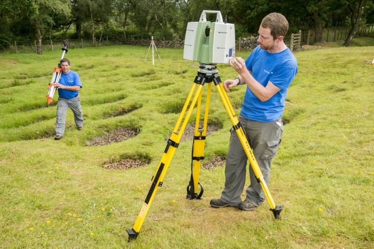 Historic Environment Scotland member of staff James Hepher using a laser scanner to digitally document the Antonine Wall