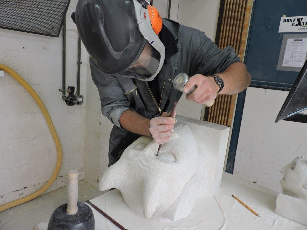 Ross Kennedy carving a grotesque
