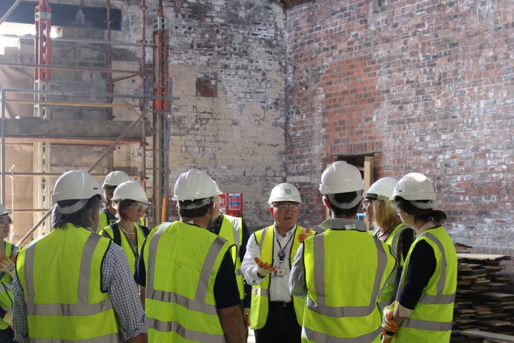The Group look at the exterior and interior features of the site