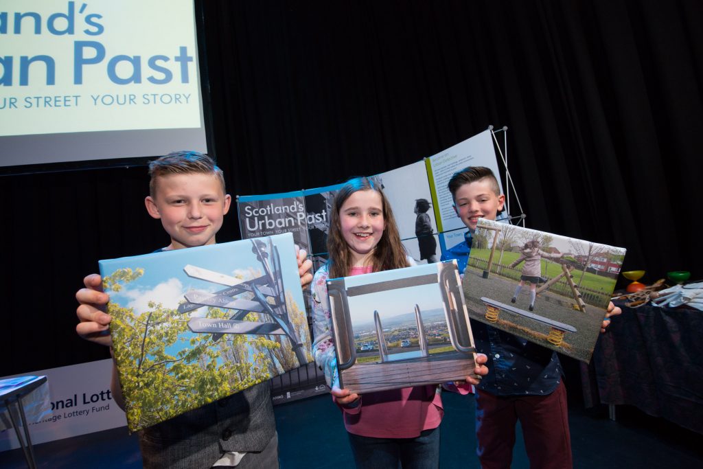  school children with photographs they took for the national record of Scotland to show future generations how Paisley looks today