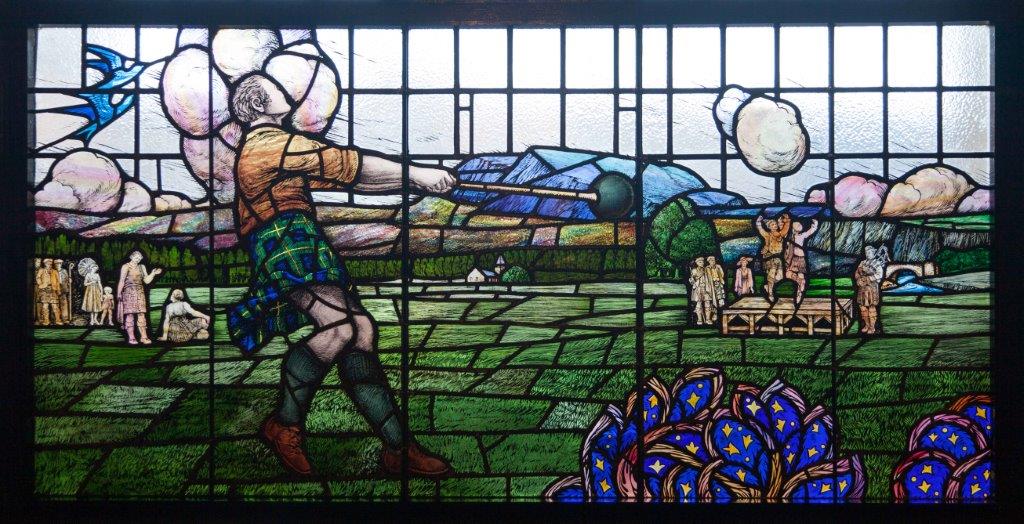 A stained glass window commemorating athlete Donald Dinnie at Huntly Arms Hotel, Aboyne.