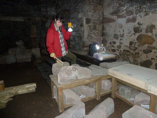 checking and cleaning the architectural stones at Balvaird Castle
