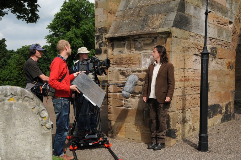 Neil Oliver filming at Dunfermline Abbey