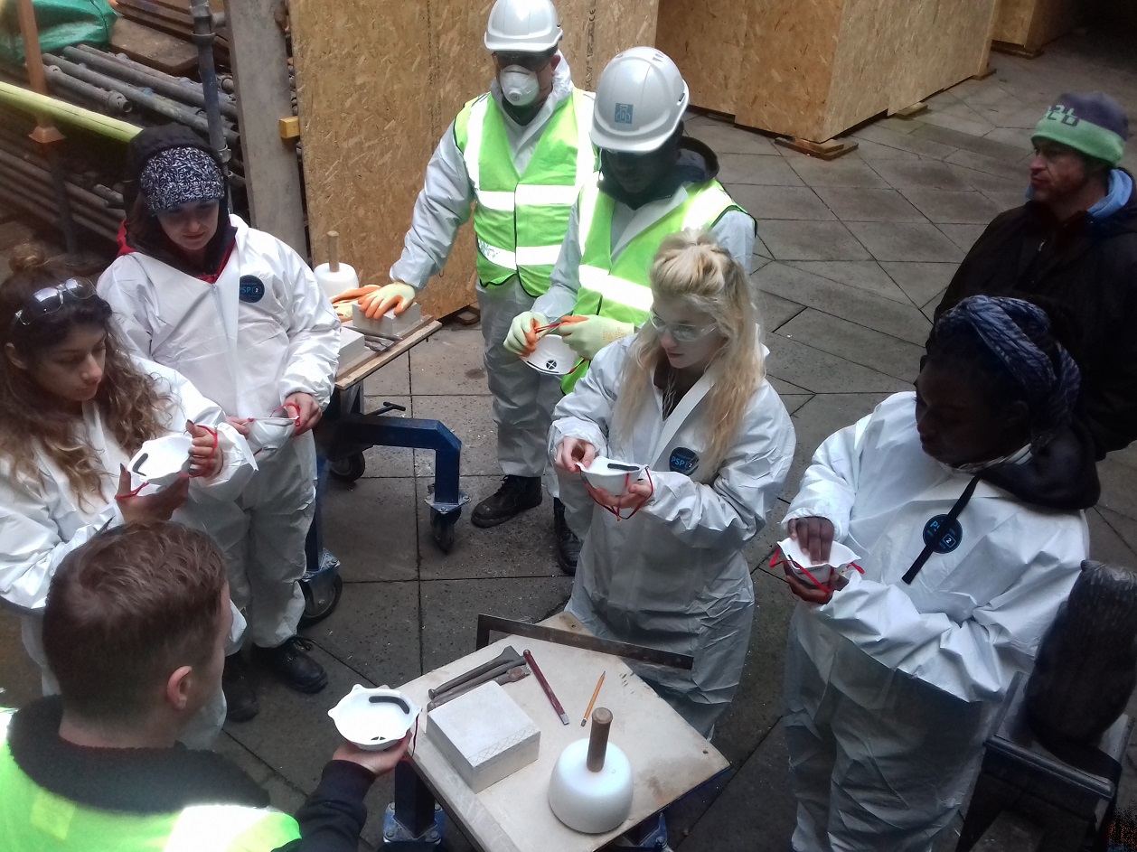 The young carers are trying out traditional skills at Stirling Castle