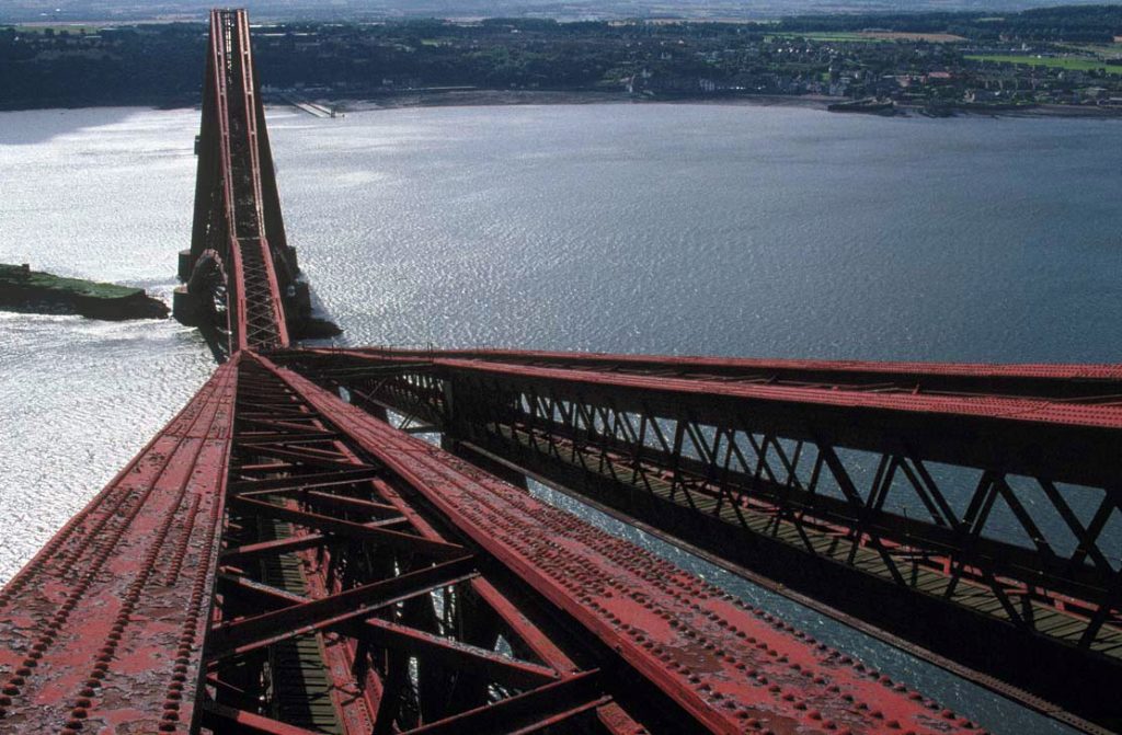 The Forth Bridge in 1989, when the old lead based paint had begun to fall off. Image by Miles Oglethorpe