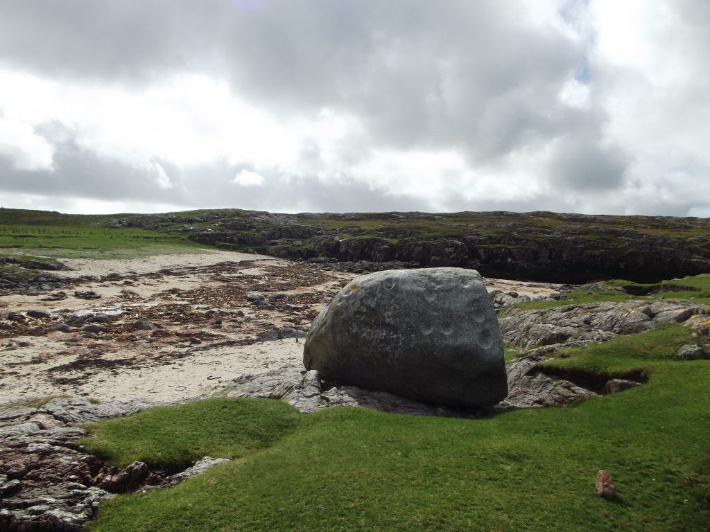 large boulder which has at least 53 circular or oval depressions or cup marks on the surface