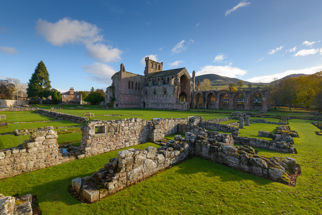 A photograph of a ruined abbey on sunny day