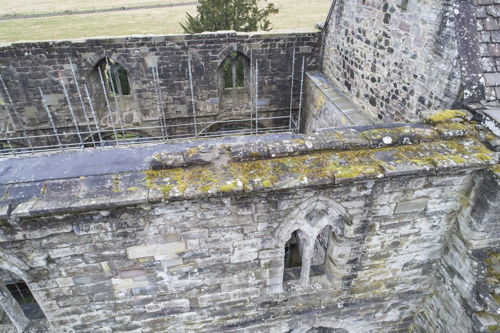 aerial view of a ruined church building with no roof