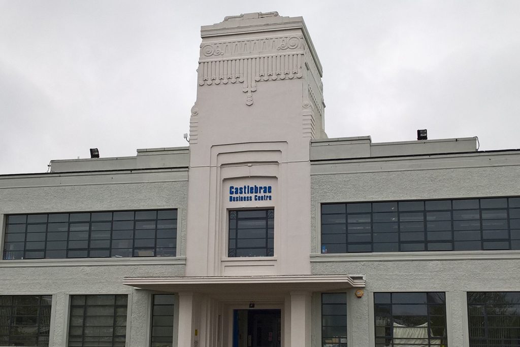 white art deco building with blue letters saying 'craigmillar business centre'