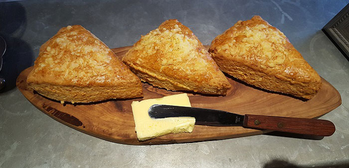 Freshly baked cheese scone platter with butter