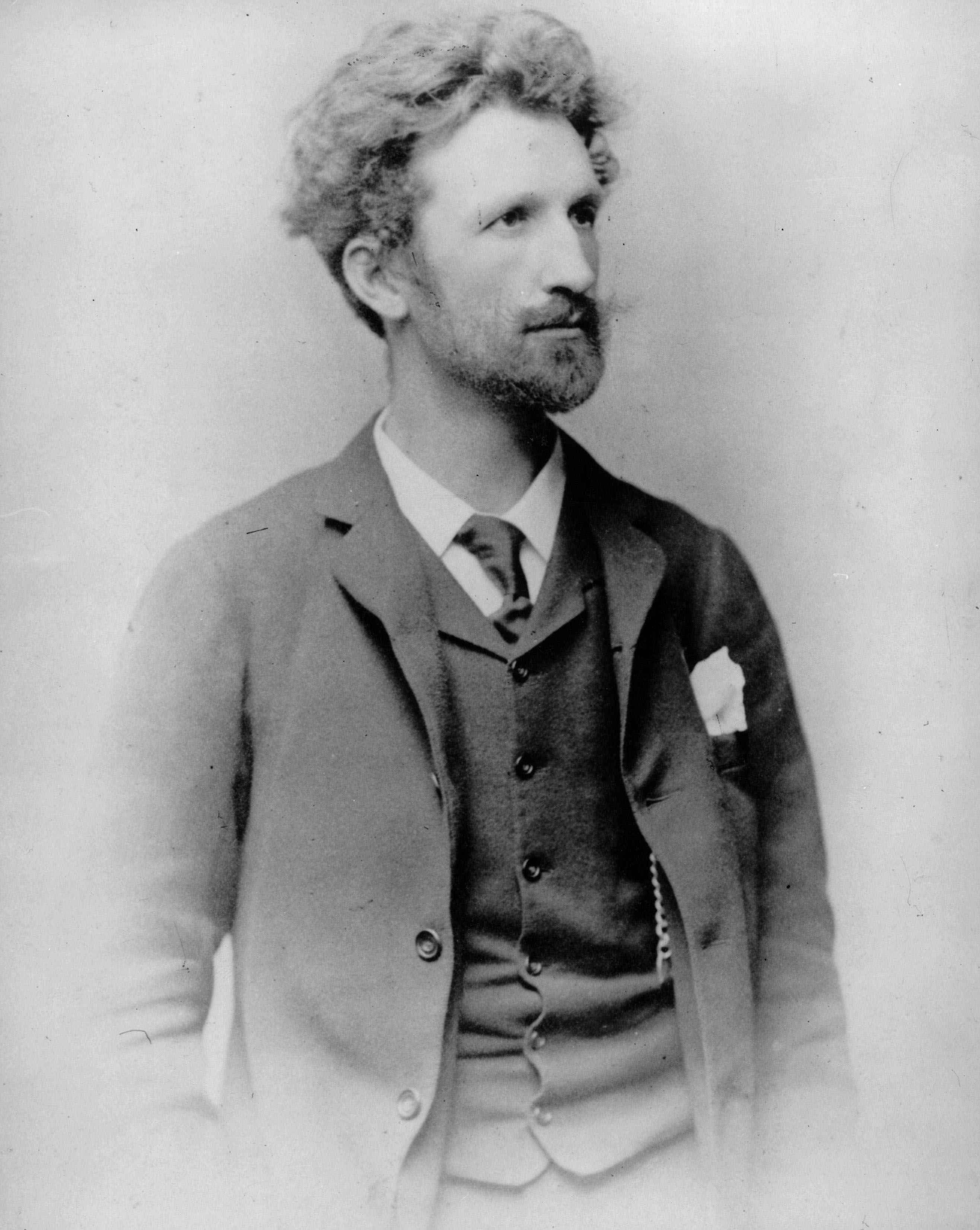 black and white photo of a man with a beard looking to the side