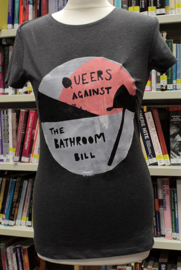 grey t-shirt with slogan reading queers against the bathroom bill