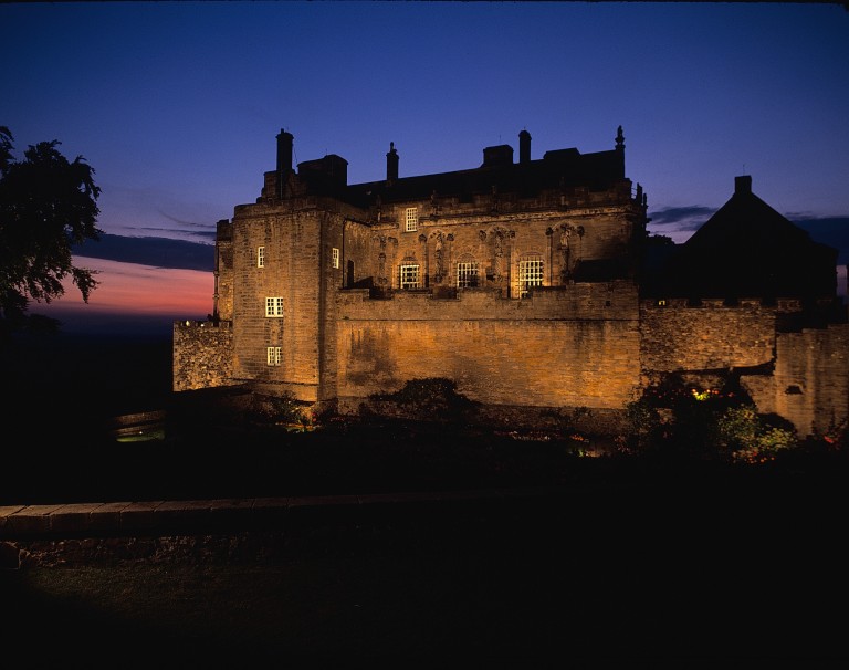 castle lit up at night