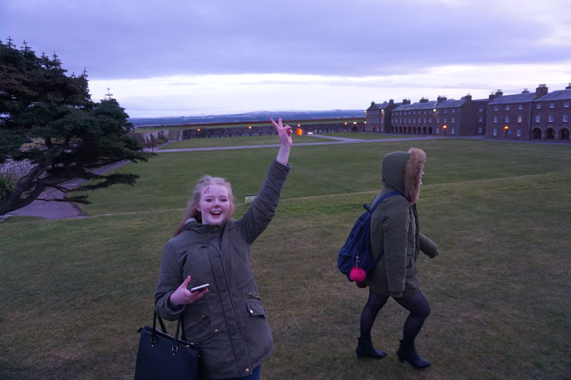 Image of two young people enjoying a trip to Fort George on Care Day 2018.