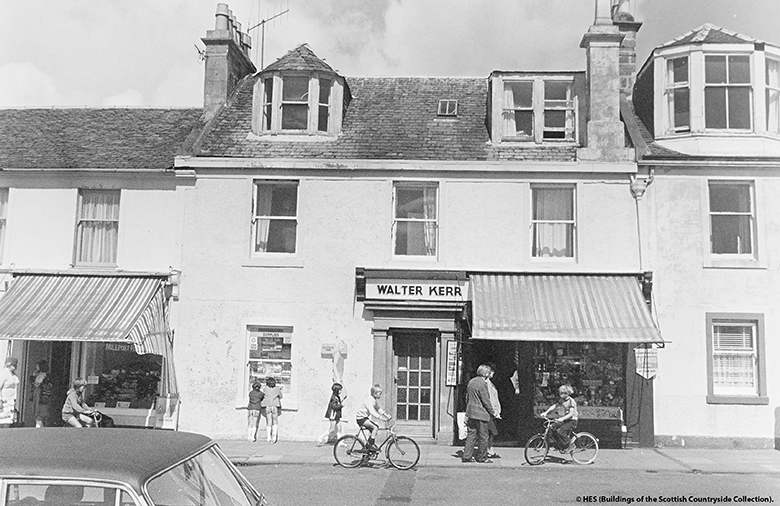 1970s Scotland. Children peer into the window of a sweet shop