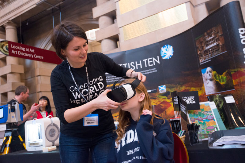 Image of a young person using a virtual reality headset at a World Heritage event