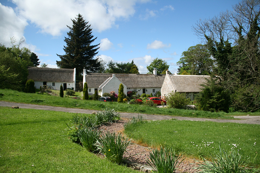 three thatched cottages