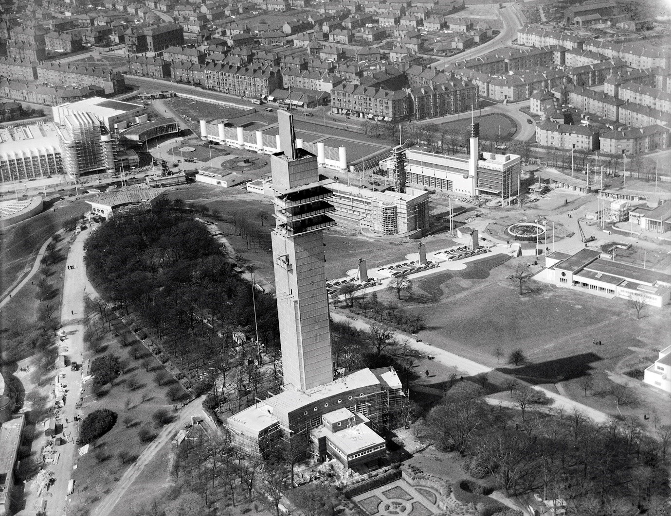 black and white view of scotland's first skyscraper from above with cityscape in background