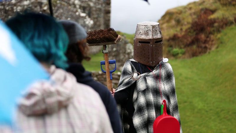 Image of a group of young people performing in a play at Urquhart Castle