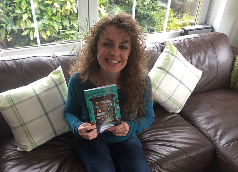 Author Megan Murray holds her self published book 'Maggie and the Magic Bookcase'