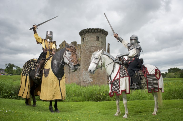 two knights on horseback face each other