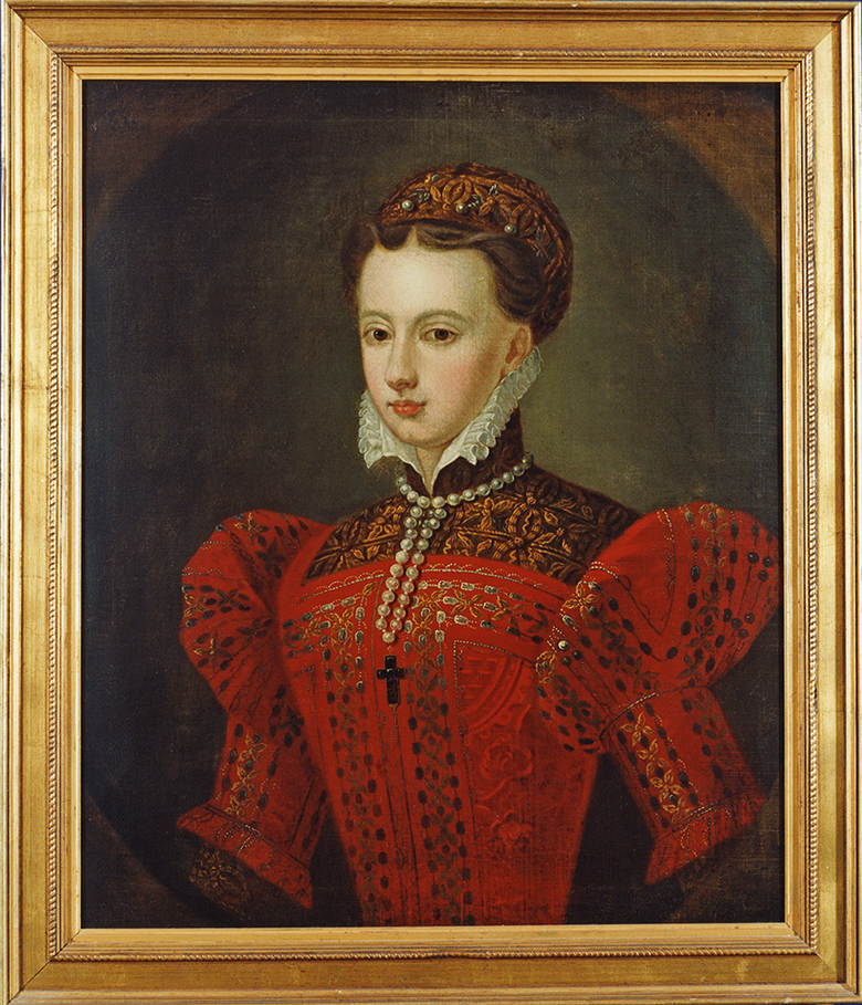 A portrait of Mary Queen of Scots. She is young, wearing an ornate red dress with a white collar. She is wearing a necklace containing a black crucifix. 
