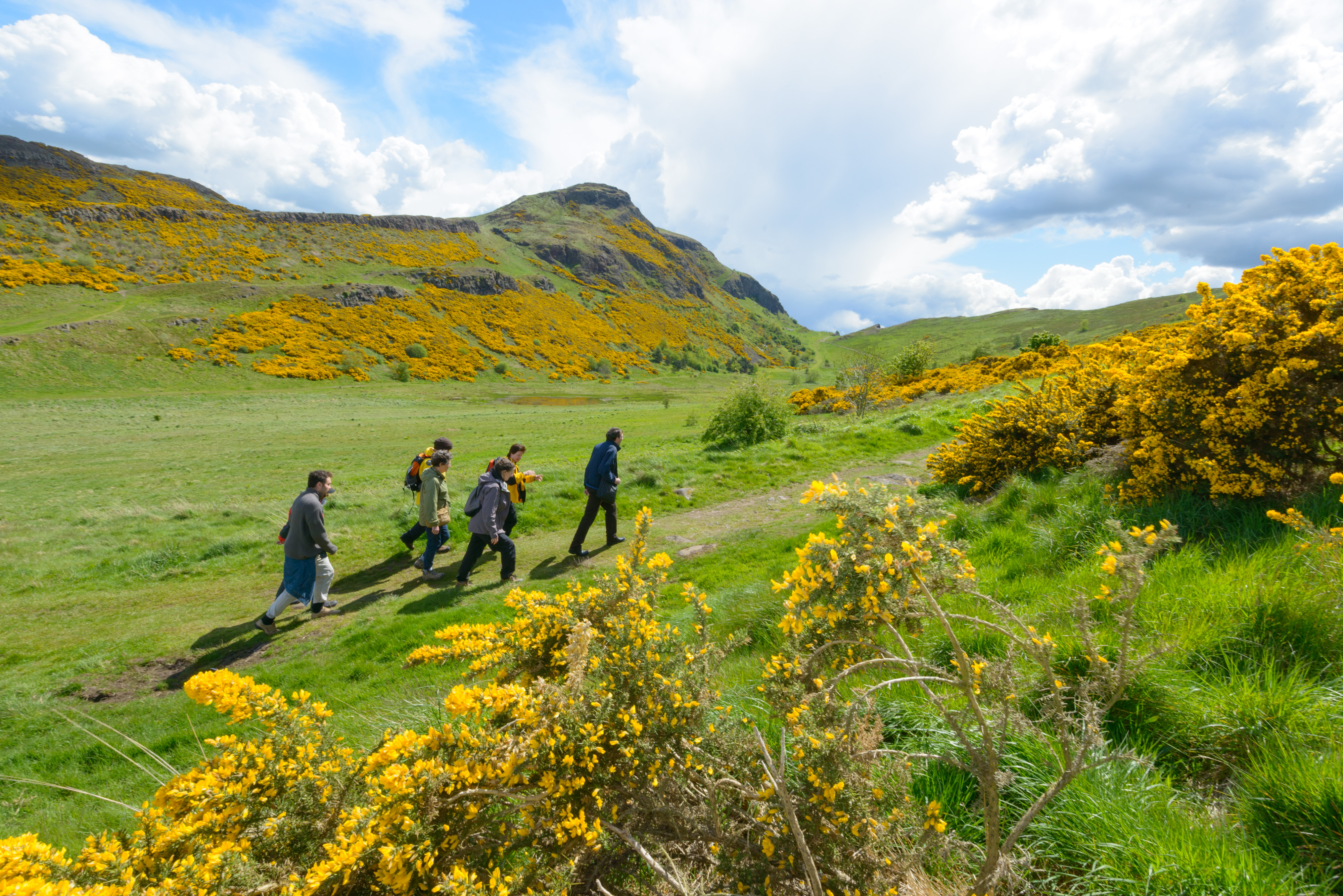 A ranger taking a group on a walk around Holyrood Park