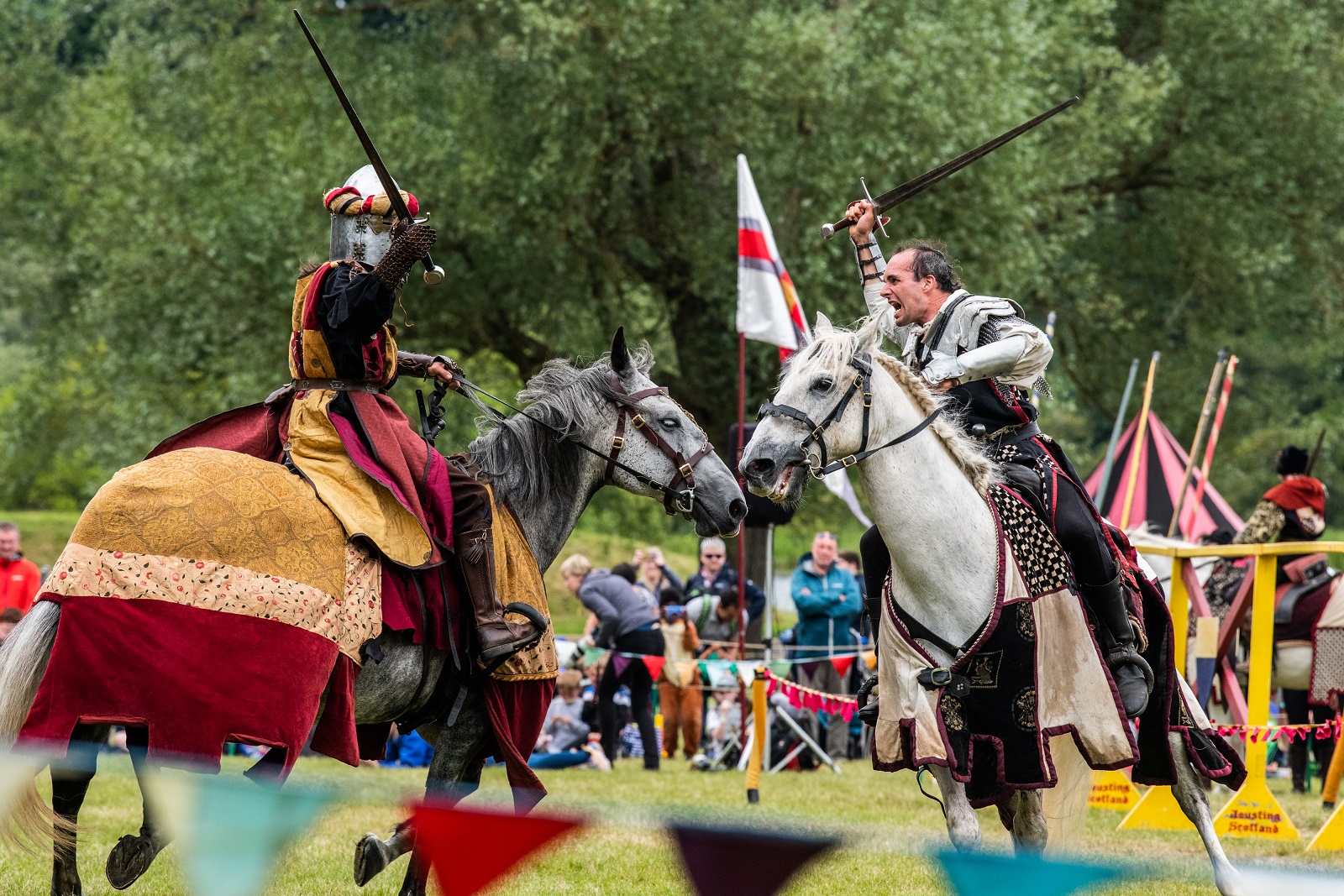 A knight on a horse riding., He carries a bow and arrow and looks at the audience triumphantly.