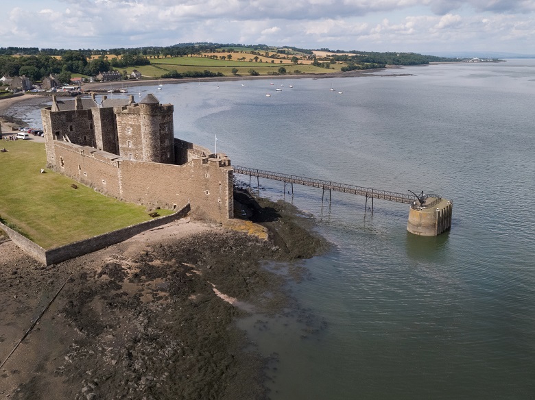 An aerial photo of Blackness Castle beside the River Forth. It is one of Historic Scotland's most popular filming locations 