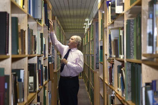 Alexander McCall Smith browsing the Historic Environment Scotland library