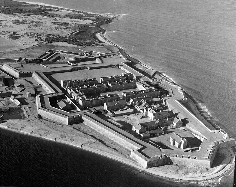 A black and white aerial shot of Fort George showing its position jutting into the Moray Firth, surrounded by water on three sides