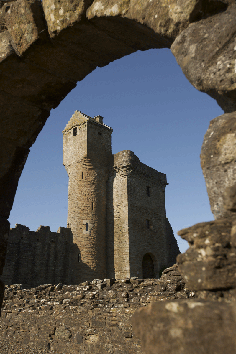 The main bell tower at Crossraguel Abbey veied though an archeway on the ground floor