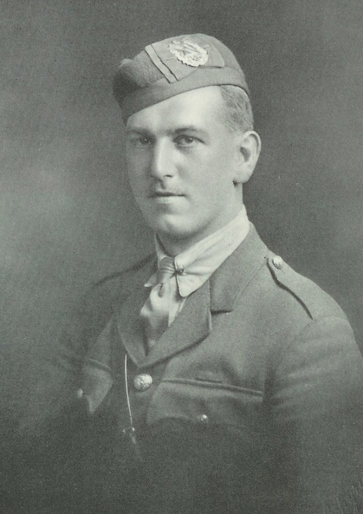 Head and shoulders portrait of a man in military uniform. He is clean-shaven.