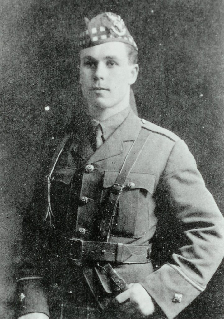 Half length portrait of a clean-shaven man in military uniform.