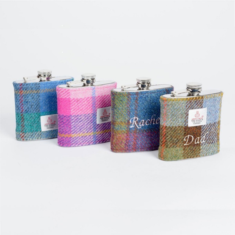 Four tweed hipflasks of various colours and personalised names including "Rachel" and "Dad"