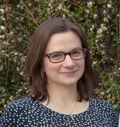 lady with shoulder length hair wearing glasses