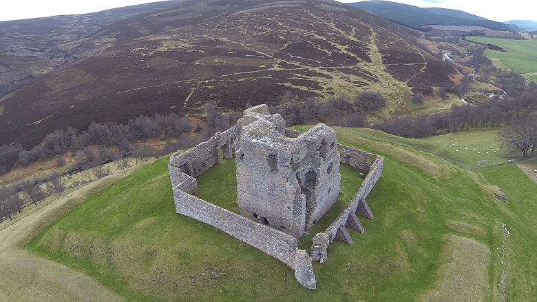 A drone photo showing Auchindoun Castle in its commanding hilltop location