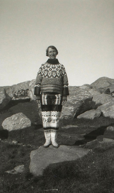 Archive image of Isobel Hutchison in traditional Eskimo dress standing on a rock in Greenland 