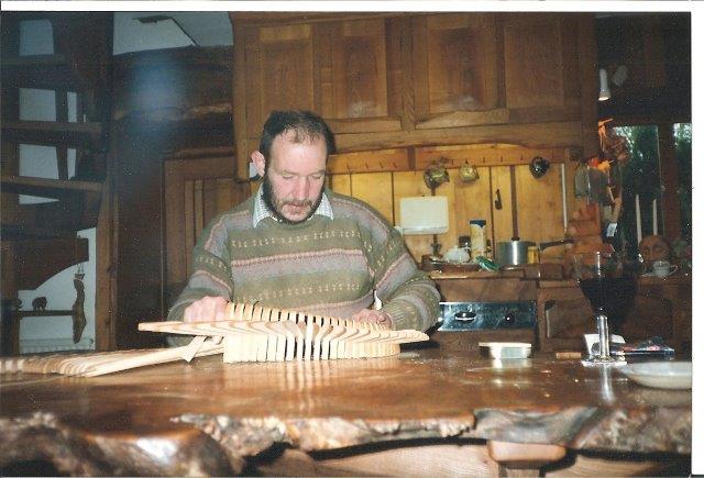 Tim Stead sculpting at a kitchen table in The Steading 