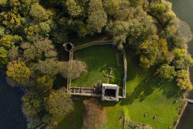 A drone photo taken directly above the ruins of Lochleven Castle showing its defensive walls and tower