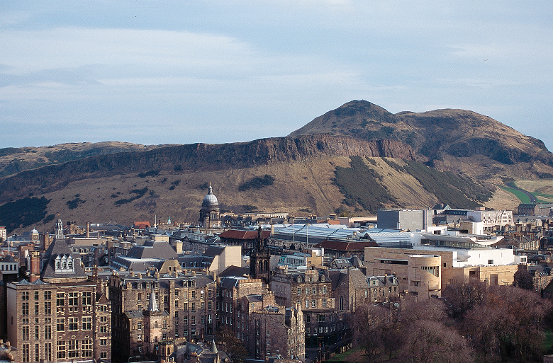 A view of Salisbury Crags in their prominent position above Edinburgh rooftops 