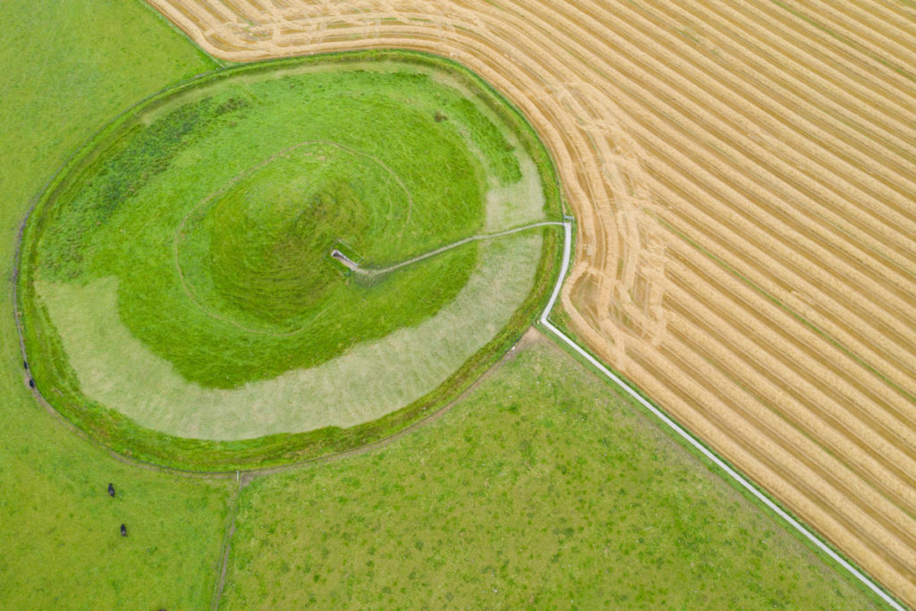 An aerial photograph of Maeshowe chambered tomb, surrounded by fields
