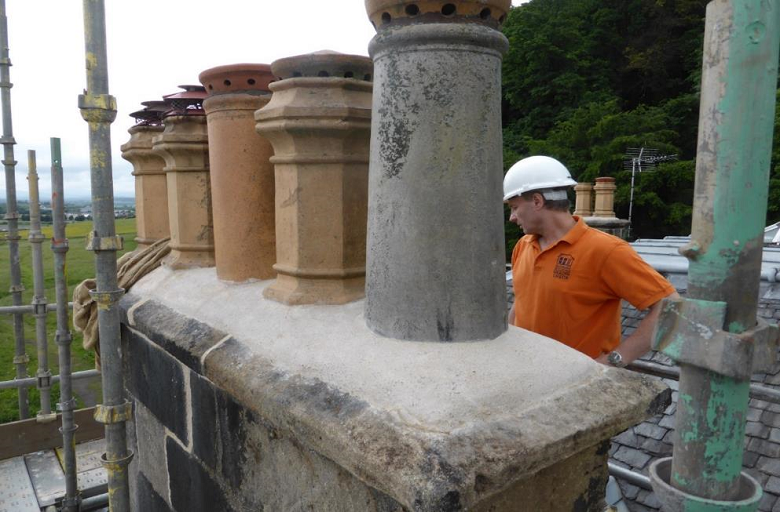 A person carrying out a chimney inspections
