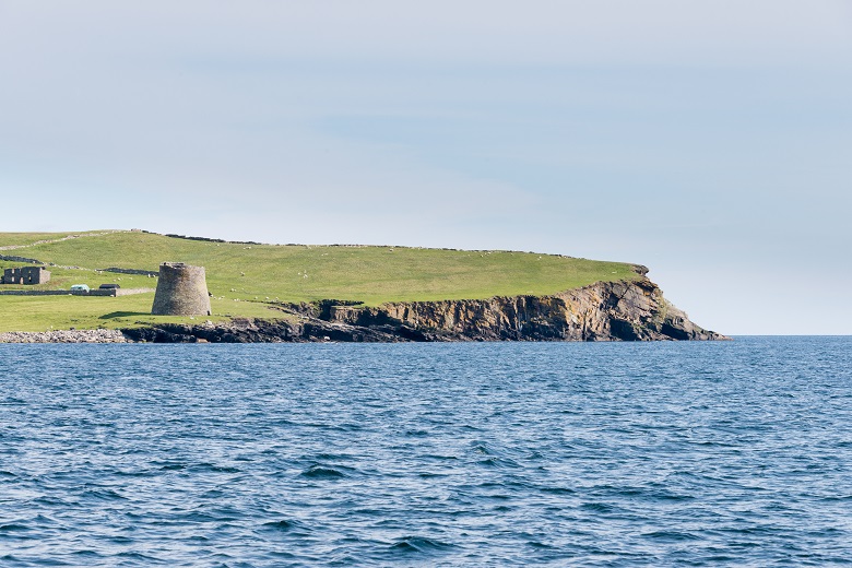 A coastal broch viewed from the sea