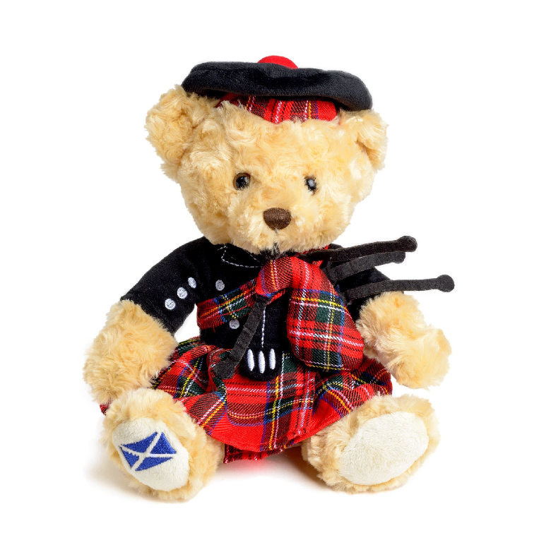 teddy bear in kilt and bonnet holding bagpipes