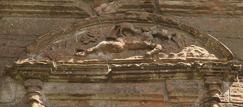 a carving shows vultures pecking a corpse.