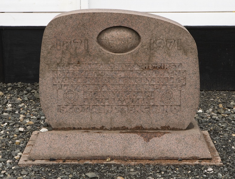 small stone monument commemorating the centenary of the first international rugby match. Features the dates 1871 and 1971. 