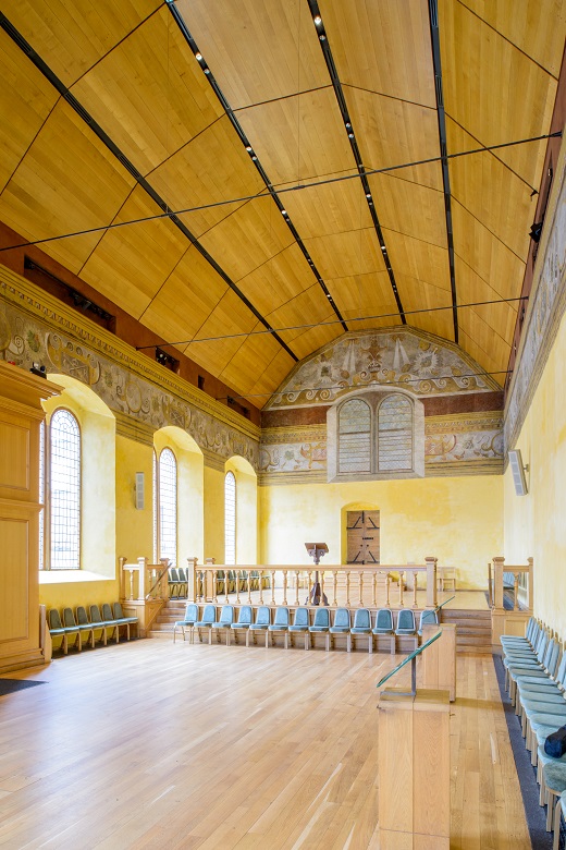 hall with curved wooden ceiling 